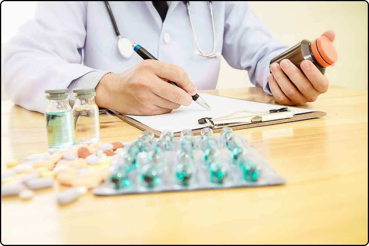 A doctor Medical professional seated at a desk, surrounded by medical equipment and documents.